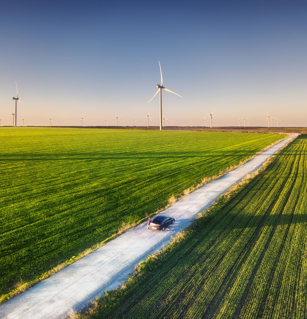 road-and-car-on-the-field-wind-power-station-lan-2025-03-06-18-56-29-utc